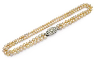 Photo courtesy Dupuis Fine Jewellery Auctioneers Double-strand natural pearl necklace with 129 pearls and old-cut diamond clasp in platinum and 18-karat white gold, circa 1930s.