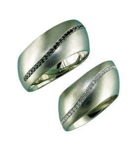 Photo courtesy Llyn L. Strelau Offset bands offer a more interesting twist on the classic gold wedding ring. The amount of offset can be fitted to the actual shape of the client's hand.