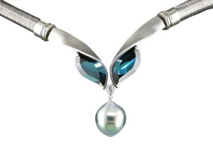 Photo courtesy Llyn L. Strelau 'Mood Indigo' pendant/clasp, with indicolite tourmalines (6.42 ctw) and one pear-shape diamond (.10 ctw) suspending a drop-shape South Sea pearl with turquoise overtone.