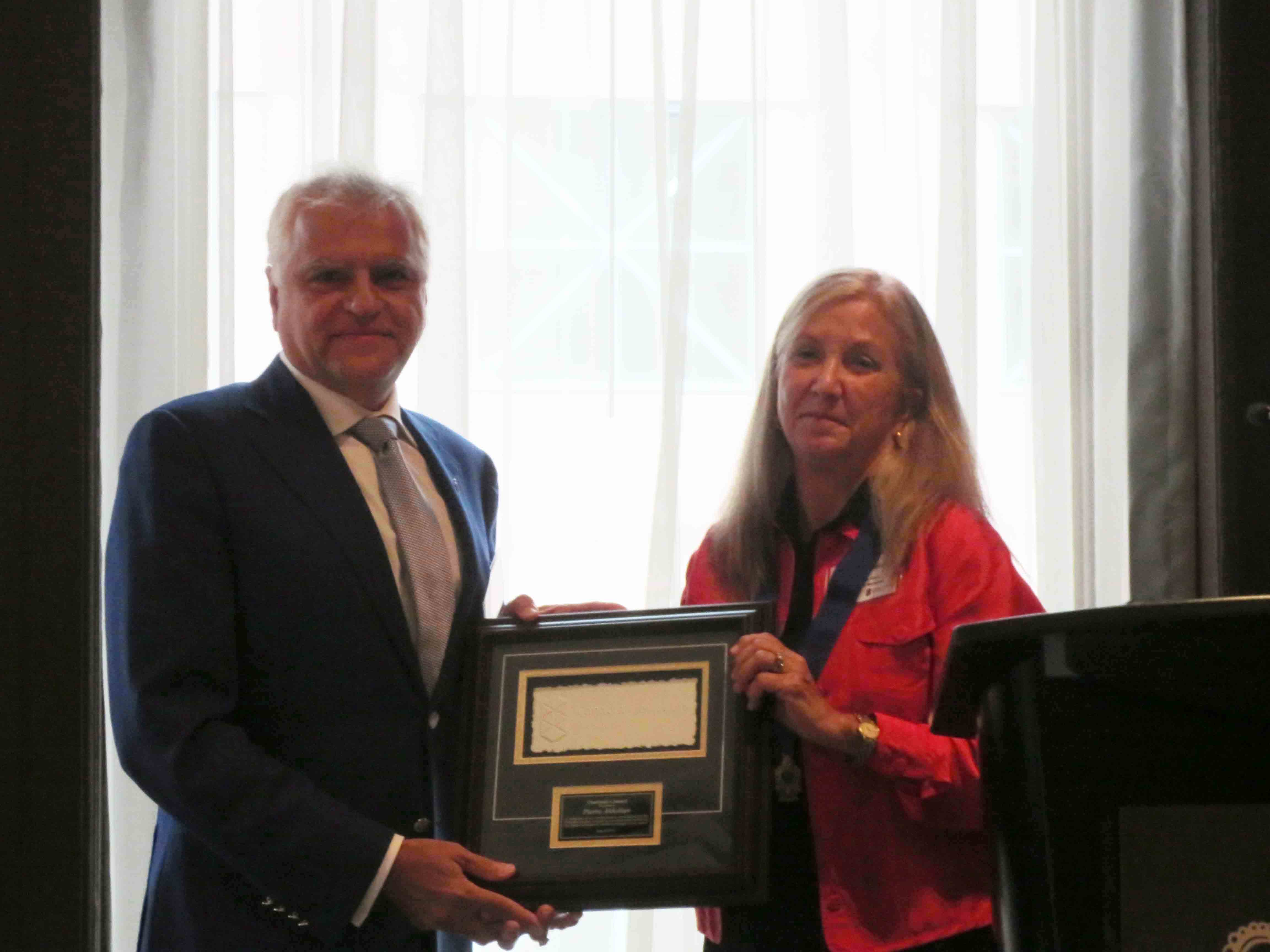 Canadian Gem president Pierre Akkelian receives the CJA Chairman's Award from incoming chair, Tanya Parrish IMG 2716