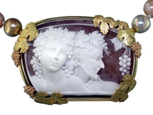 Photo courtesy Llyn L. Strelau Antique shell cameo with 18-karat yellow, rose, and green gold grape leaves and red gold grape cluster accents.