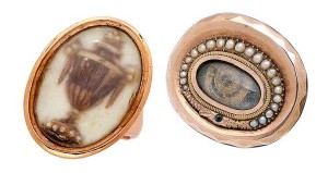 Photo courtesy Dupuis Fine Jewellery Auctioneers At left is a 19th-century memorial ring mounted in 14-karat gold. Its design features an urn composed of hair that is accented by seed pearls within a glazed compartment. To the right is a 10-karat gold snake motif memorial brooch centring a coiled lock of hair within a glazed frame and surrounded by a split-pearl ouroboros.