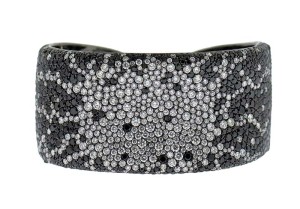 Photo courtesy Gina D'Onofrio This labour-intensive black and white diamond cuff may be sold at a lower price point due to lower production costs in Asia. Its valuation should reflect that.