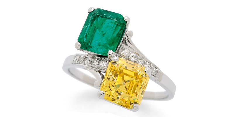Photo courtesy Dupuis Fine Jewellery Auctioneers 'Toi et moi' platinum ring by Birks, with a 3.12-carat Asscher-cut fancy vivid yellow diamond and a Colombian emerald.