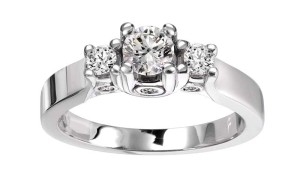 14-karat white gold ring by Polar Ice, with .50-carat Canadian centre stone, sides (.30 carats), and bezel-set diamonds (.14 ctw).