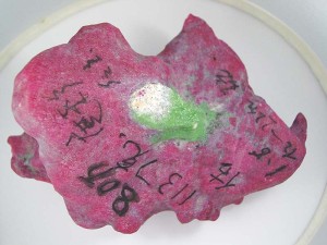 Photo courtesy Mark T. Cartwright Only ruby from East Africa occurs with massive green zoisite, disproving the claims of higher value due to the purported Burmese origin of this stone.
