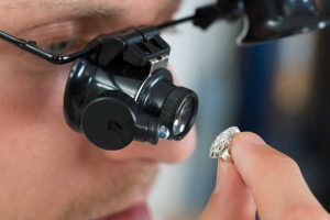 Photo © Bigstock.com bigstock-jeweler-looking-ring-with-loup-96128525