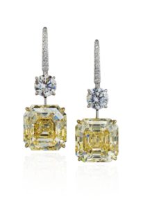 These earrings feature two yellow diamonds: one weighing 13.35 carats and the other weighing 12.03 carats. Photo © Christie’s