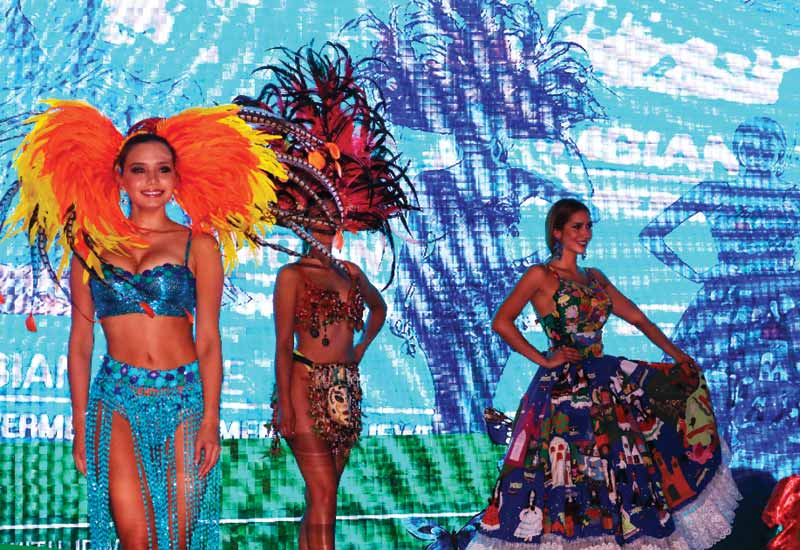 Photo courtesy 2WES Models dressed in traditional Colombian attire wear emerald earrings during the gala dinner at the 2WES.
