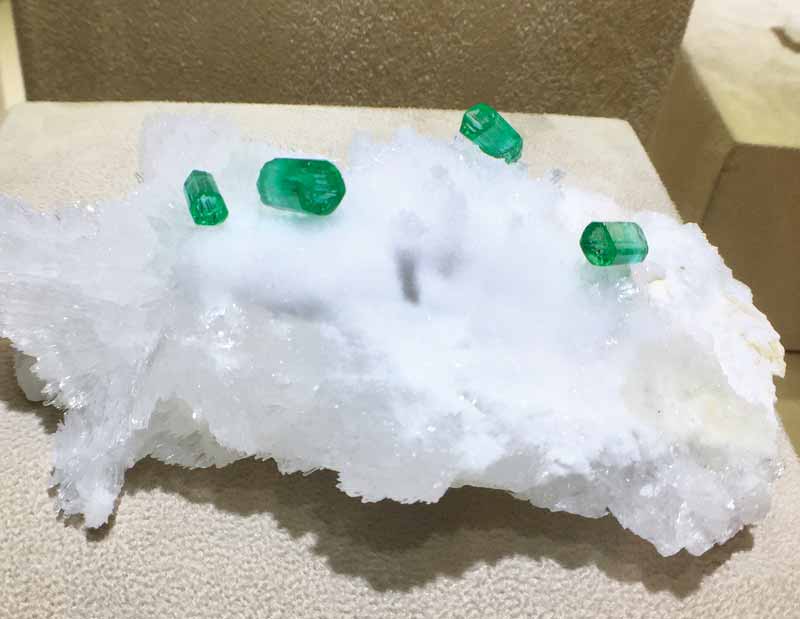 Photo courtesy Lalta Keswani Emerald crystals in matrix displayed by the Emerald Museum.