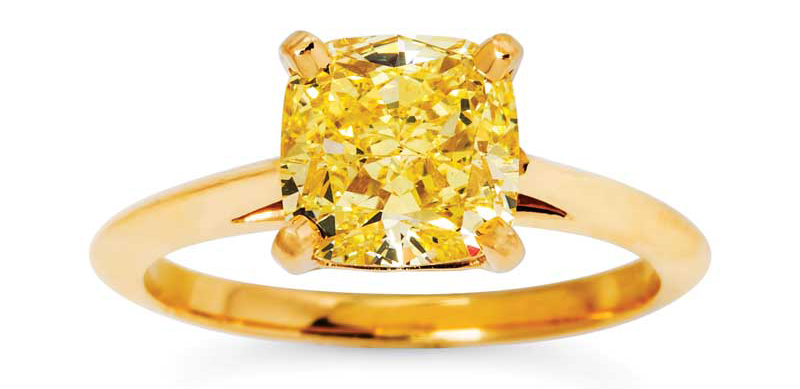 A yellow diamond solitaire and gold ring by Tiffany & Co.