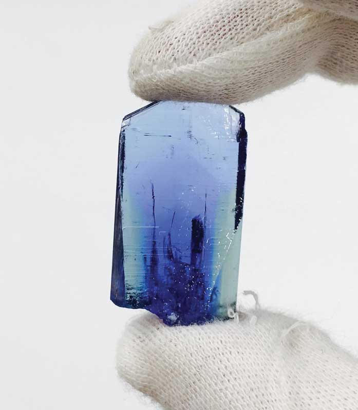 Typical Tanzanite rough with two colours showing of its pleochroism.Typical Tanzanite rough with two colours showing of its pleochroism.