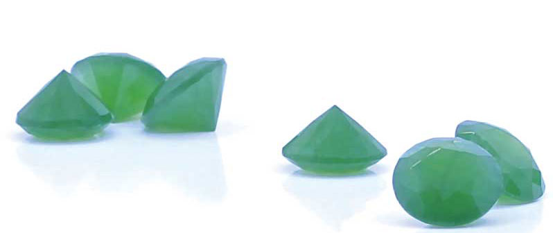 Photo by Veronica Cosio/courtesy New Sun Design Group Figure 2: Trademarked ‘Jade Diamond:’ standard round, brilliant-cut nephrite jade, weighing approximately one carat. Photo by Veronica Cosio/courtesy New Sun Design Group