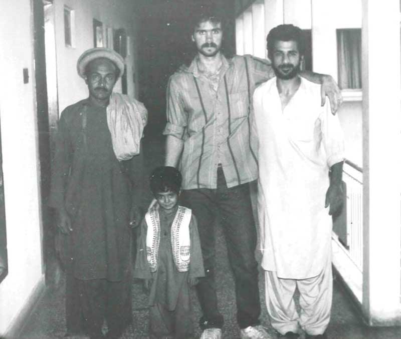 Left to right: An Afghan fighter, his son, Sid Tucker, and an Afghan gem trader in the late 1980s.