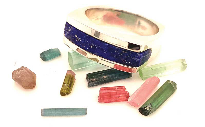 Tourmaline rough from Afghanistan with a lapis lazuli ring.