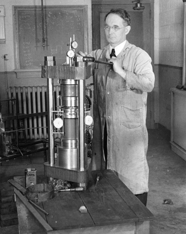 Figure 3: Percy Williams Bridgman at the Lyman Laboratory at Harvard University, adjusting a high-pressure press with two stages of external support for reaching 50,000 kg/cm2. This new press was made in 1938. Harvard University, courtesy AIP Emilio Segrè Visual Archives