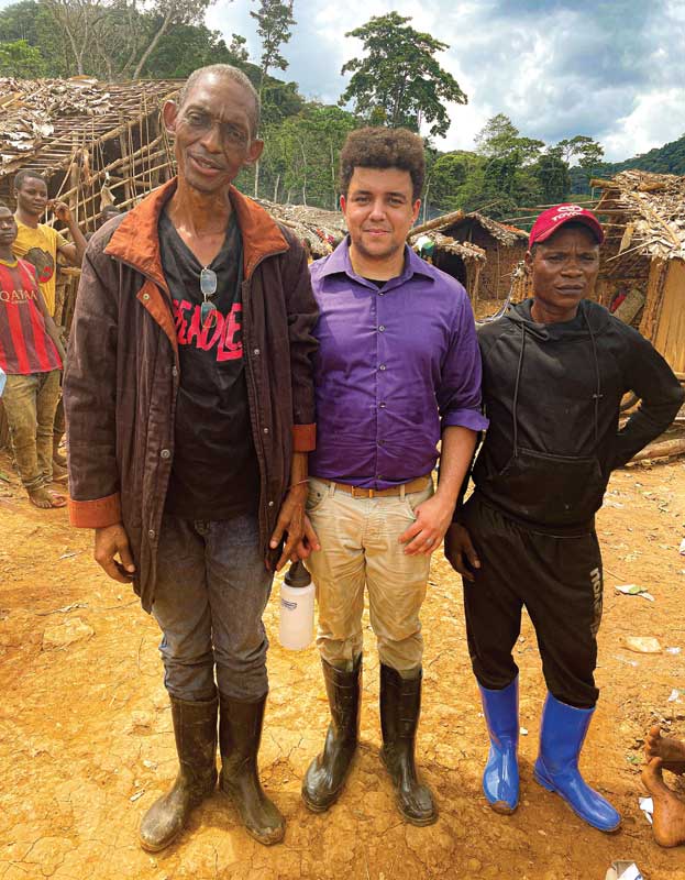 The author, Kyle Abram (centre), at Mirundu with two representatives from the local co-op. Photo courtesy Kyle Abram