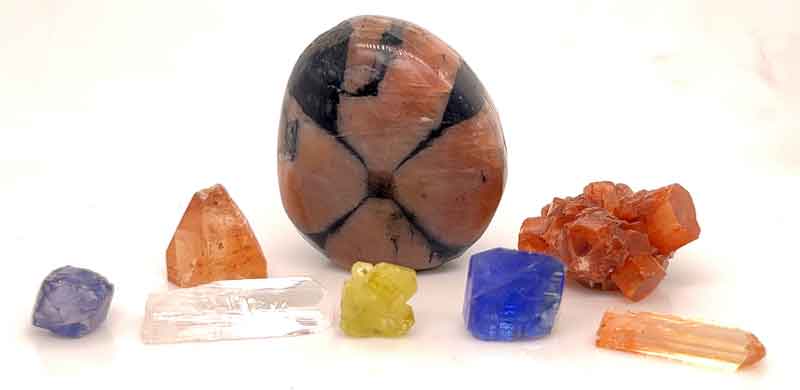 Stones from the orthorhombic system (from left): Iolite, danburite, topaz, chrysoberyl, andalusite, Tanzanite, aragonite, and topaz.