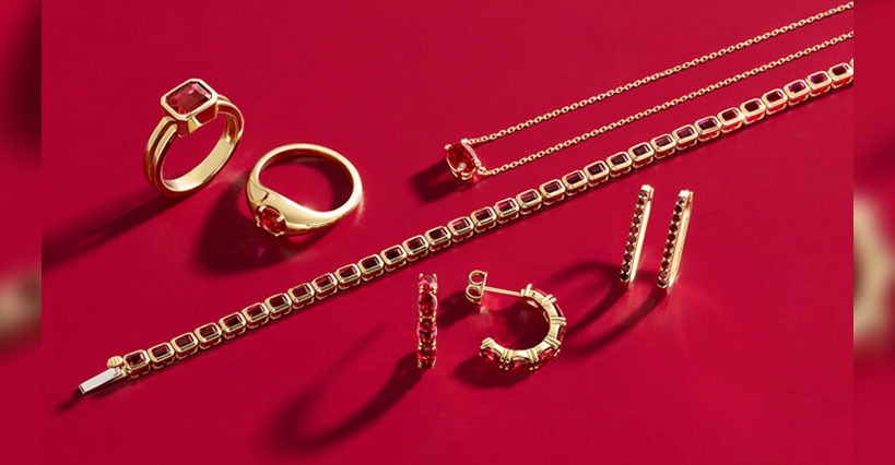 gold jewellery on a red background