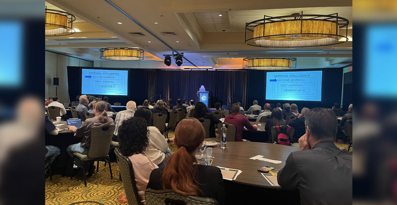 TJS attendees watch a presentation.