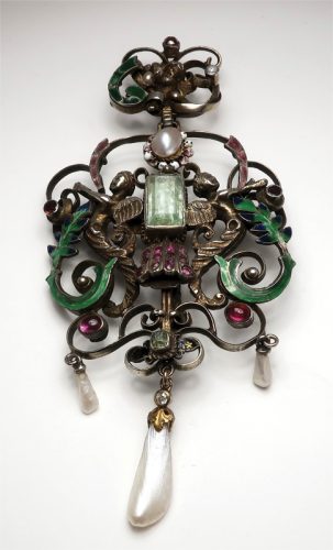 A renaissance revival silver and gem brooch in silver with enamel.