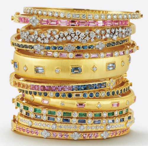 Tanya Farah stack of 18K gold bangles with diamond and gemstones.