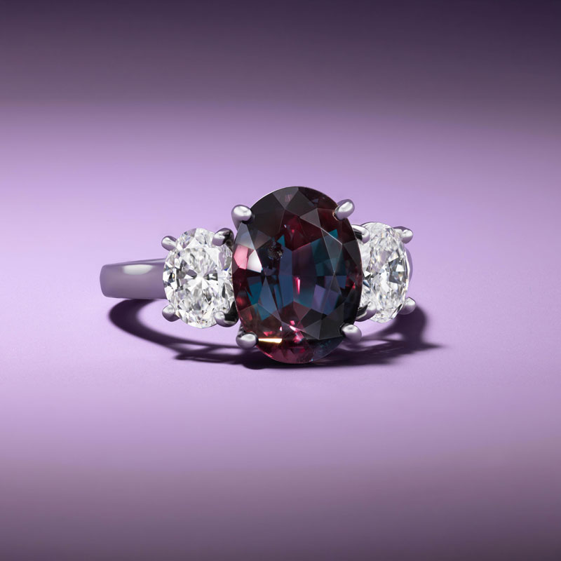 diamond ring with purple background