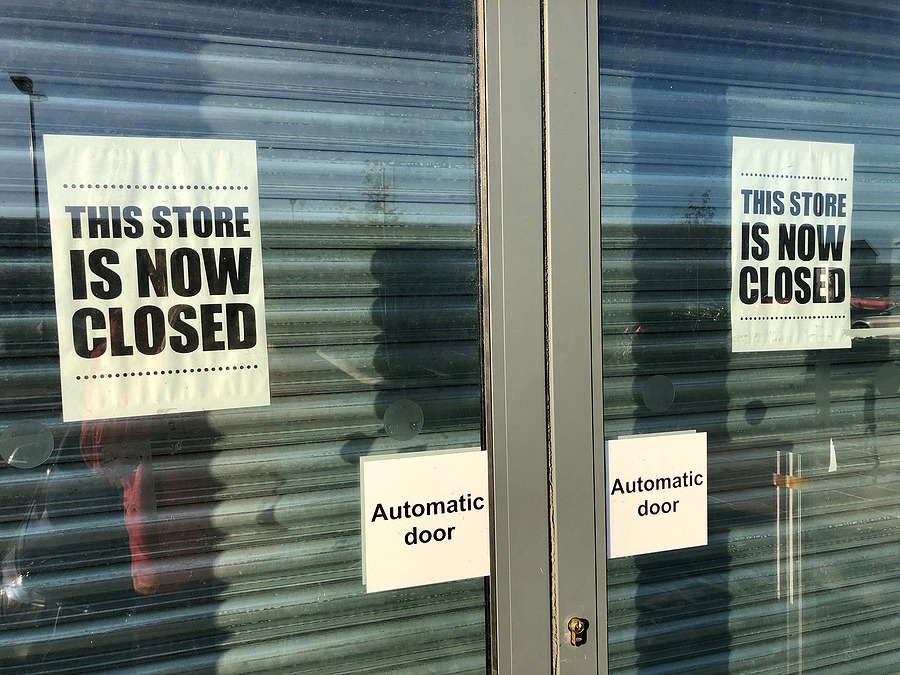 closed glass door with sign that says 