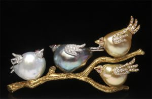 brooch of birds sitting on branches