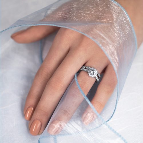 close up shot of hand with silver ring on ring finger