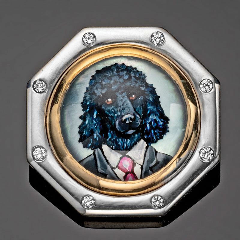 Octagonal diamond-bordered brooch with a painted portrait of a poodle dressed in a suit and tie.